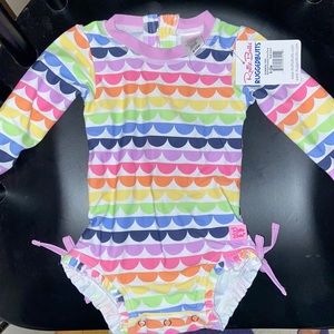 Brand new with tags Rufflebutts swim suit, size 6-12 months. UPF 50